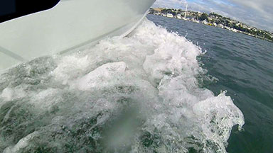 Motor boat prow cutting through water